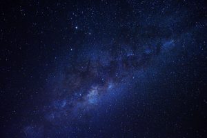 Astrochemical Synthesis: How Deep-Space Radiation Forges the Molecular Scaffolding of Life